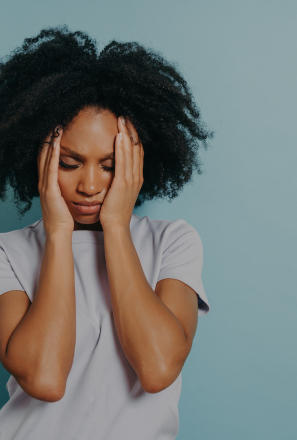 Woman experiencing tiredness and fatigue, highlighting Pact Nutrition's UK-made supplements for energy and tiredness support