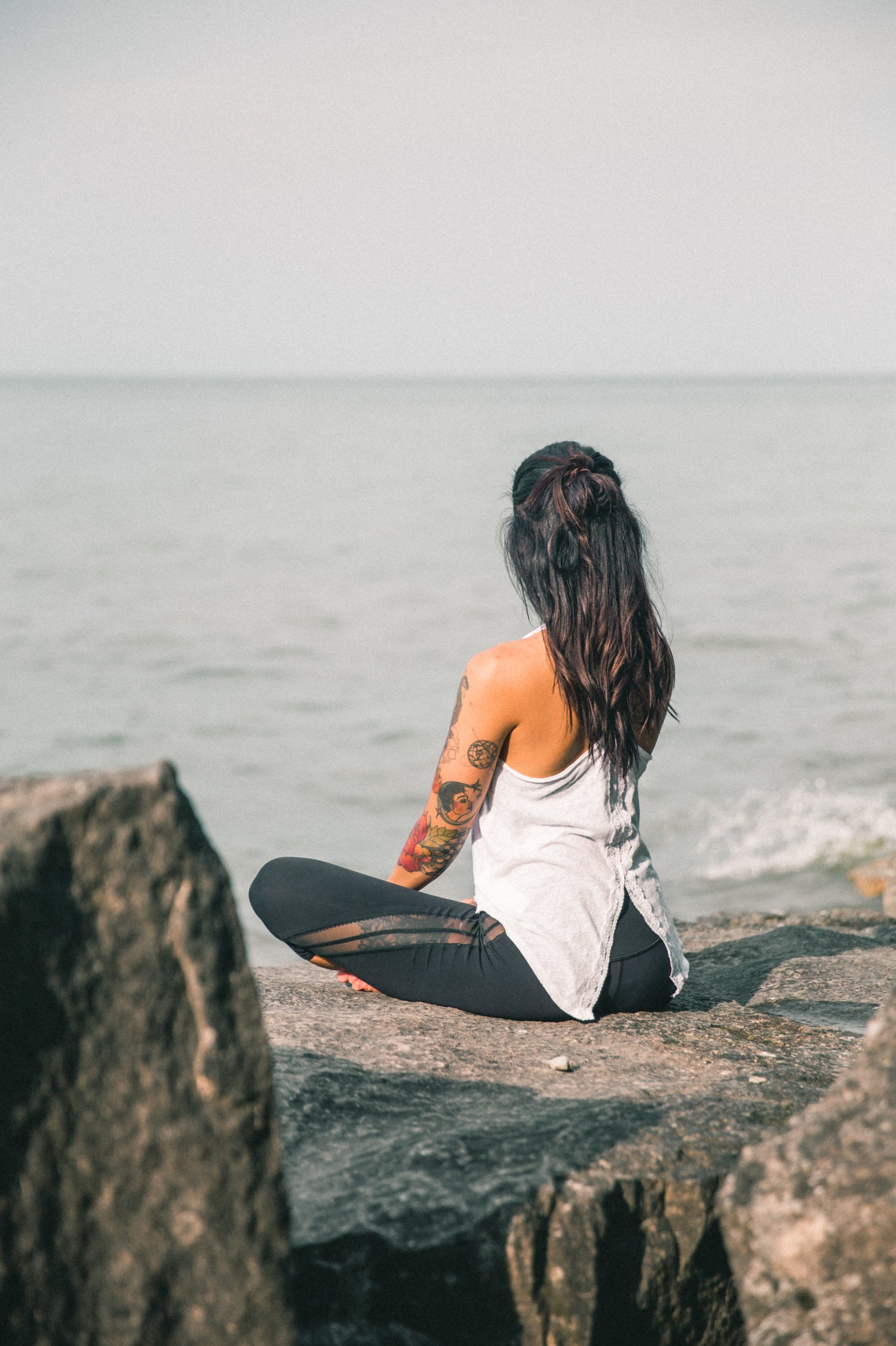 Woman meditating as part of her wellness journey, symbolizing holistic health with support from Pact Nutrition’s UK-made supplements